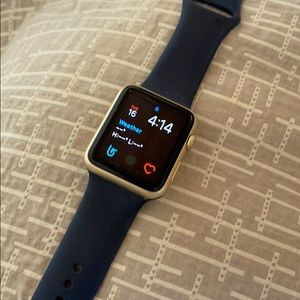 42MM gold Apple Watch.